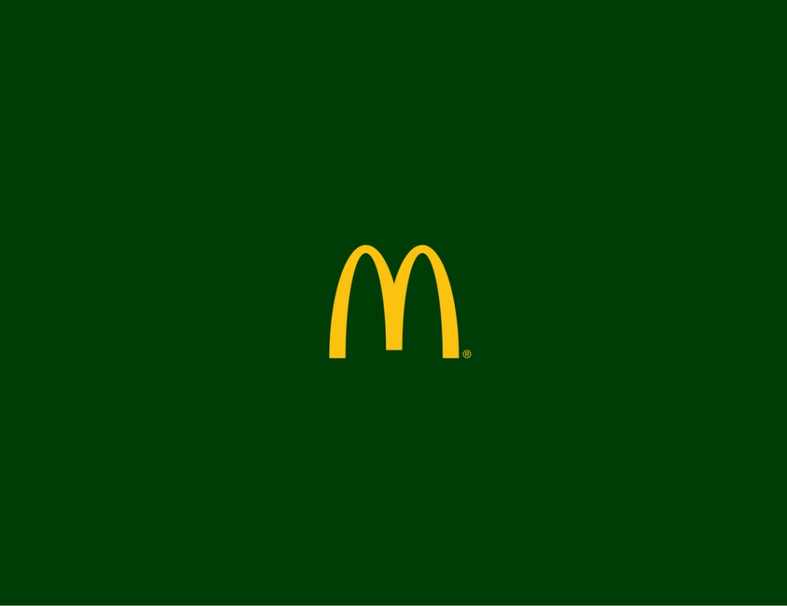 The yellow McDonalds Golden Arches logo is centered on a solid dark green background.